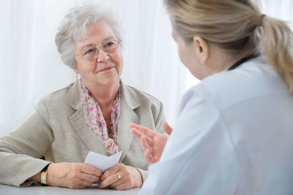 doctor explaining diagnosis to his female patient