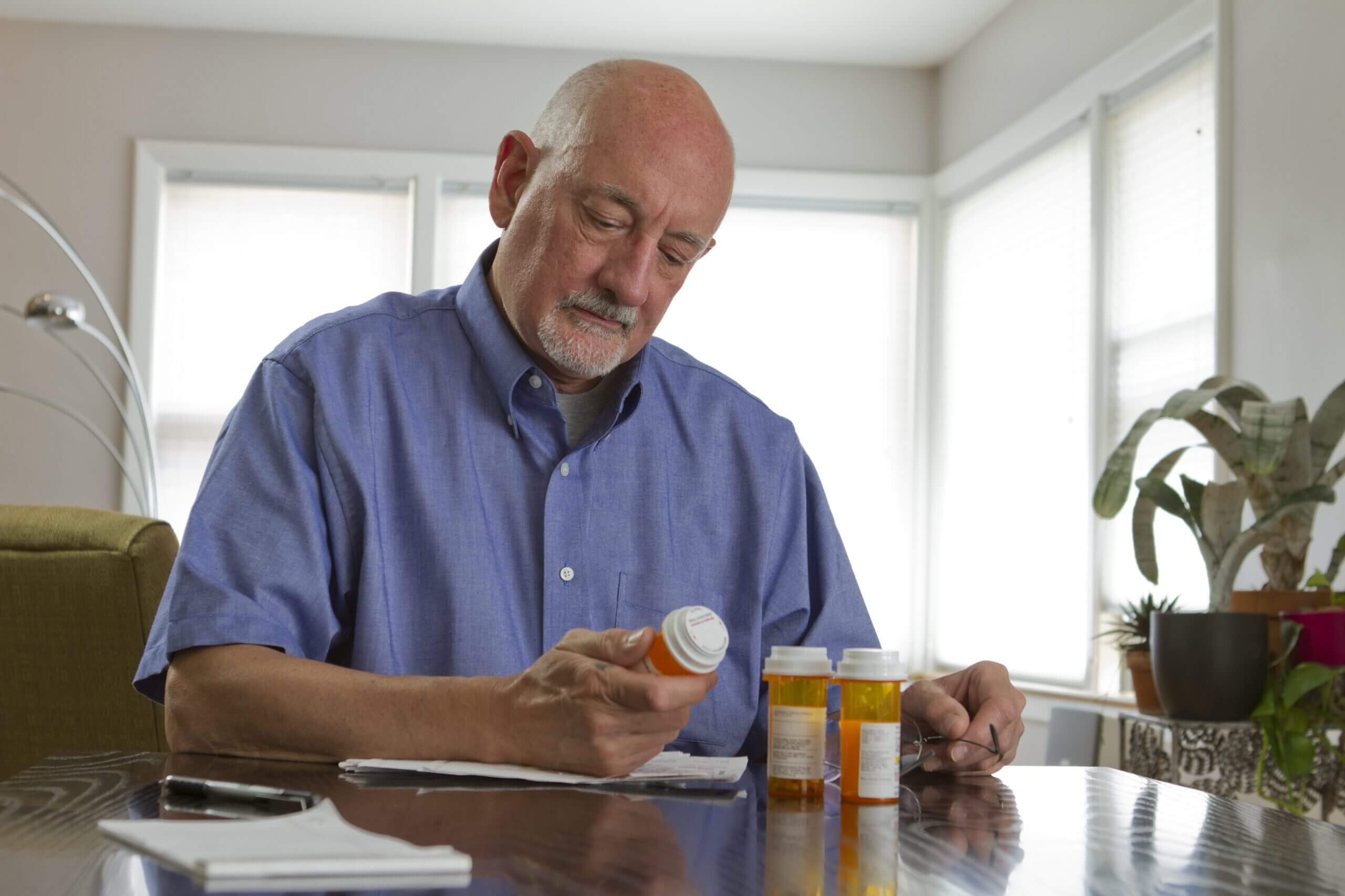 older man with medications